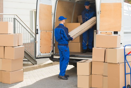Removals team preparing a move with protective safety measures