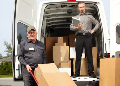 Removal team planning a home move in a French city street