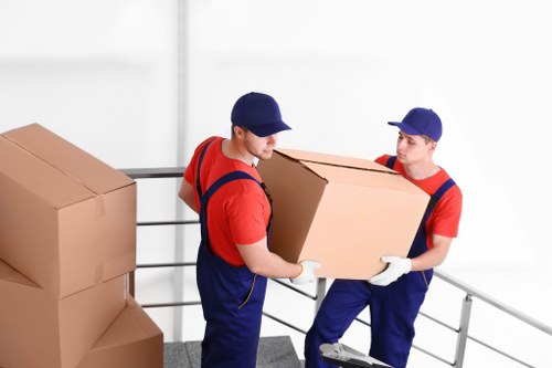 Man and van moving furniture in a French city street