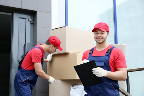 Removal team preparing a move in a French city apartment building