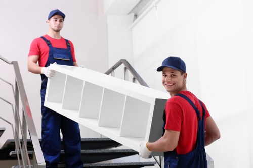 Commercial office relocation equipment and furniture being moved in France