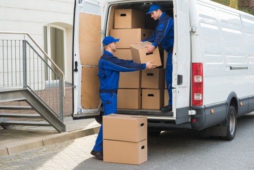 Removal team handling household items during a move in France