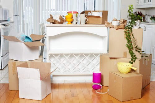 Business relocation team preparing office furniture and boxes for a commercial move in France