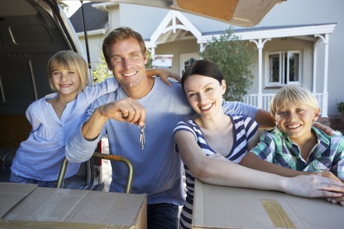 Local moving team packing and transporting household furniture