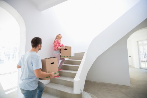 Local movers handling office equipment in a French city