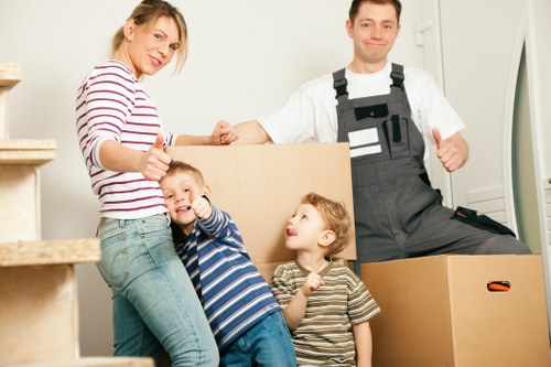 Packed moving boxes and furniture ready for transport in France